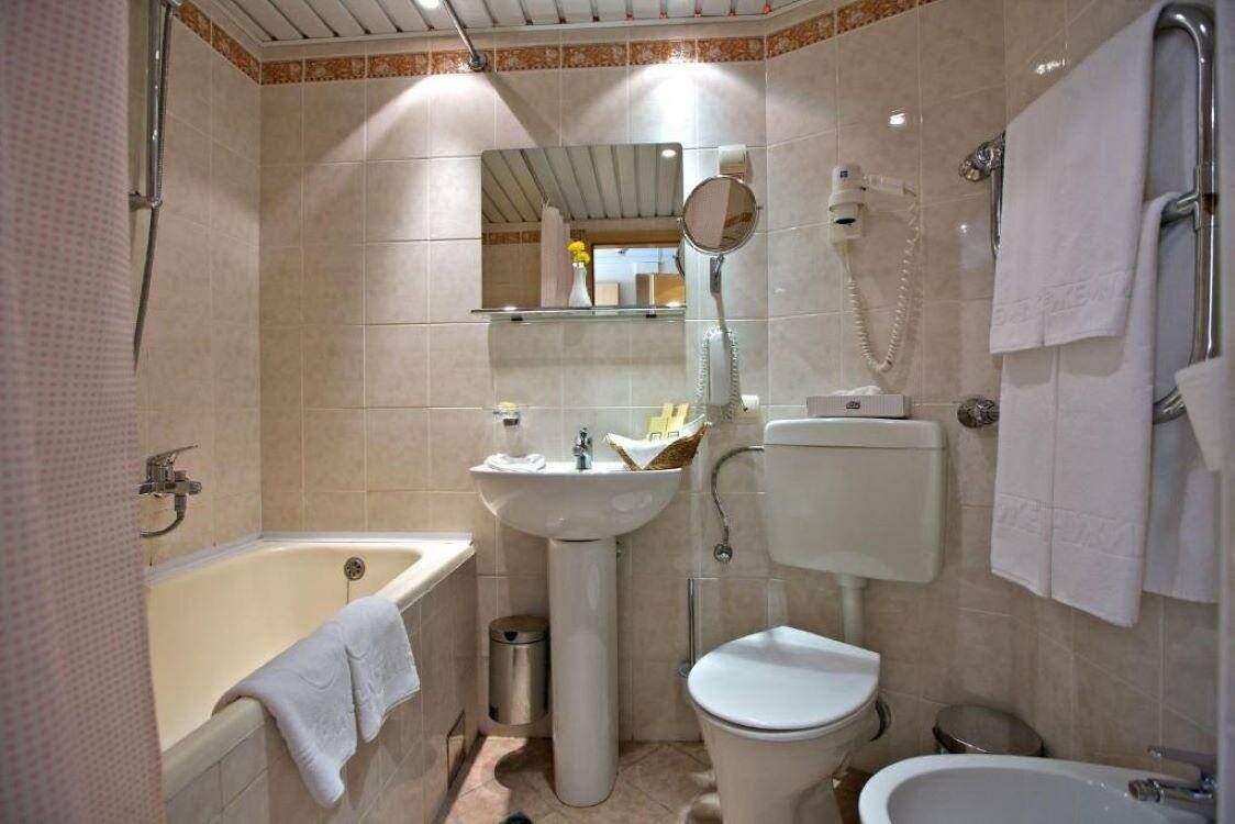 Фотографии номера Номер стандарт бизнес с 2 односпальными кроватями в Гостинице Жемчужина Сочи